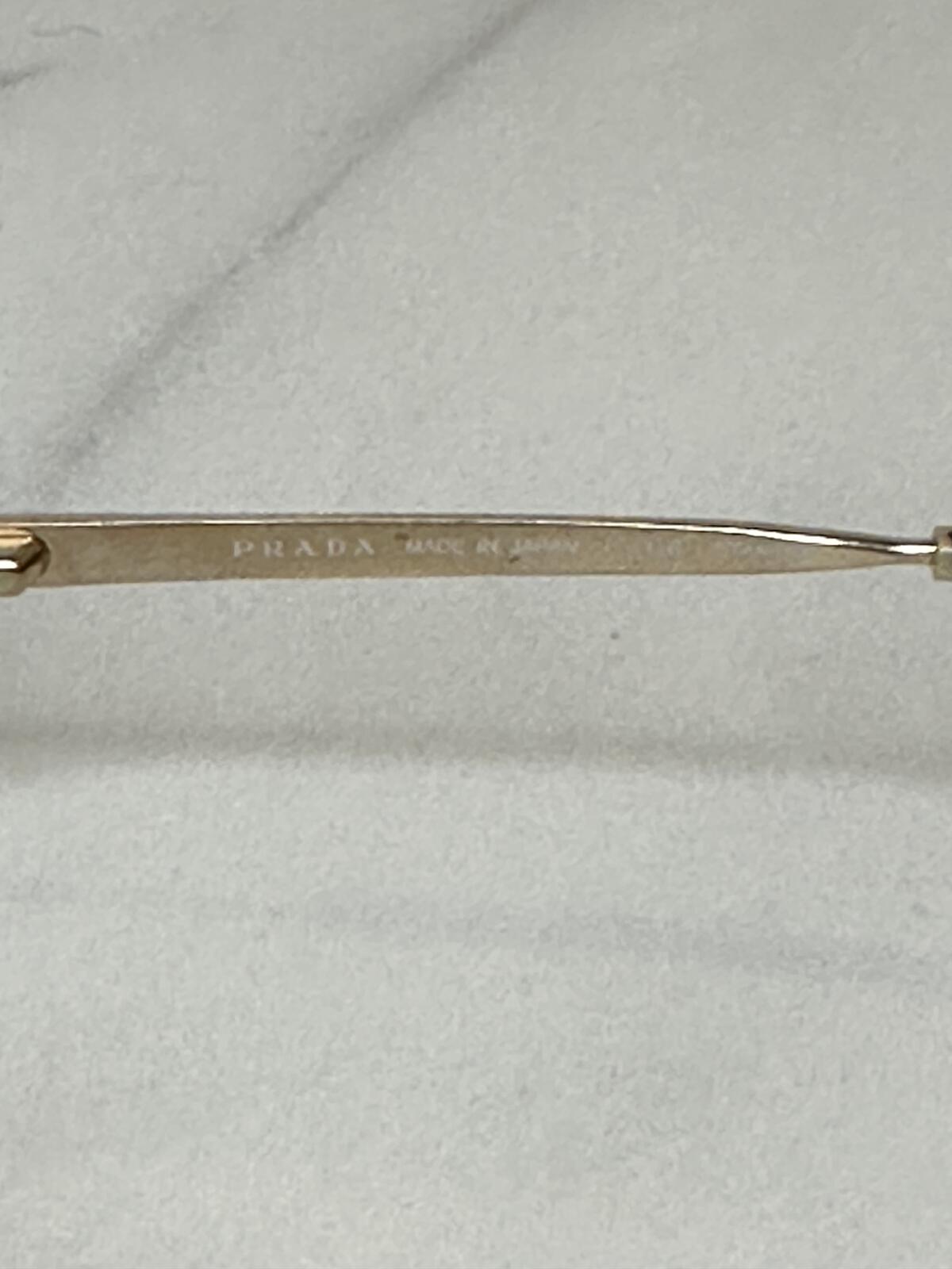 Prada VPR 03R gold tone cat-eye eyeglasses 55-16-135