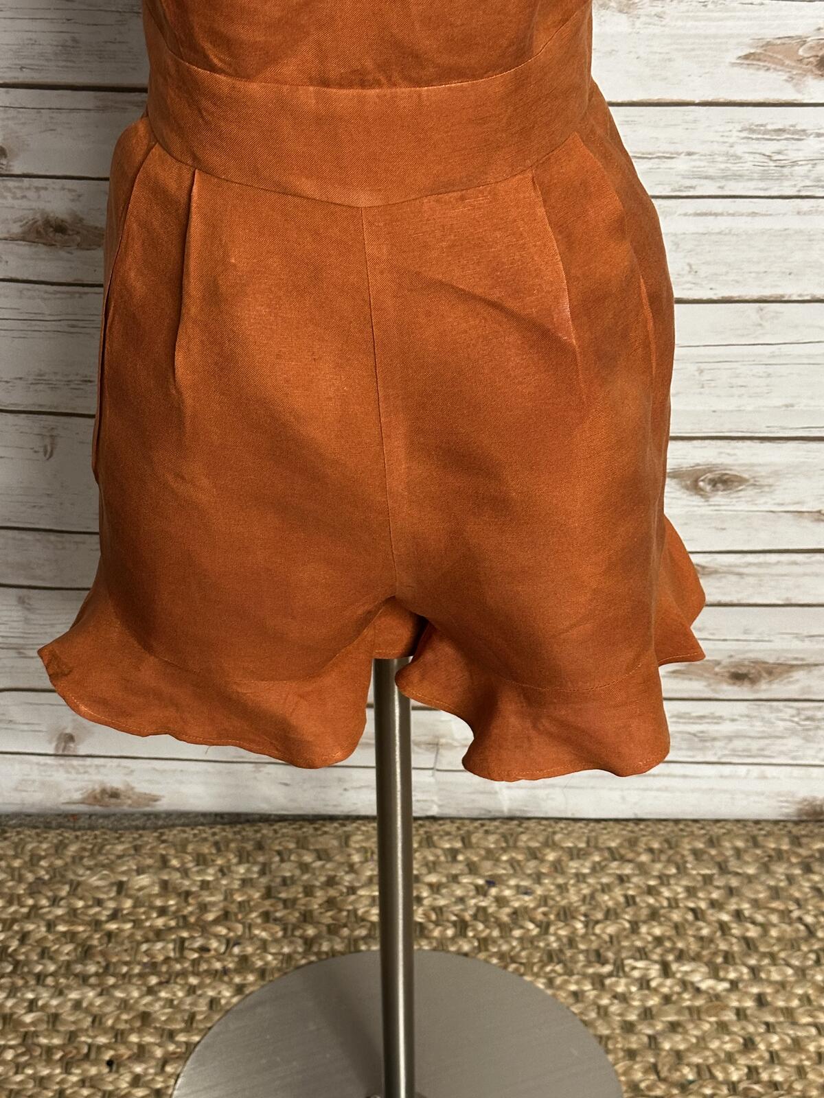 LOFT sleeveless ruffled hem romper Size 4 linen-blend rust coastal summer