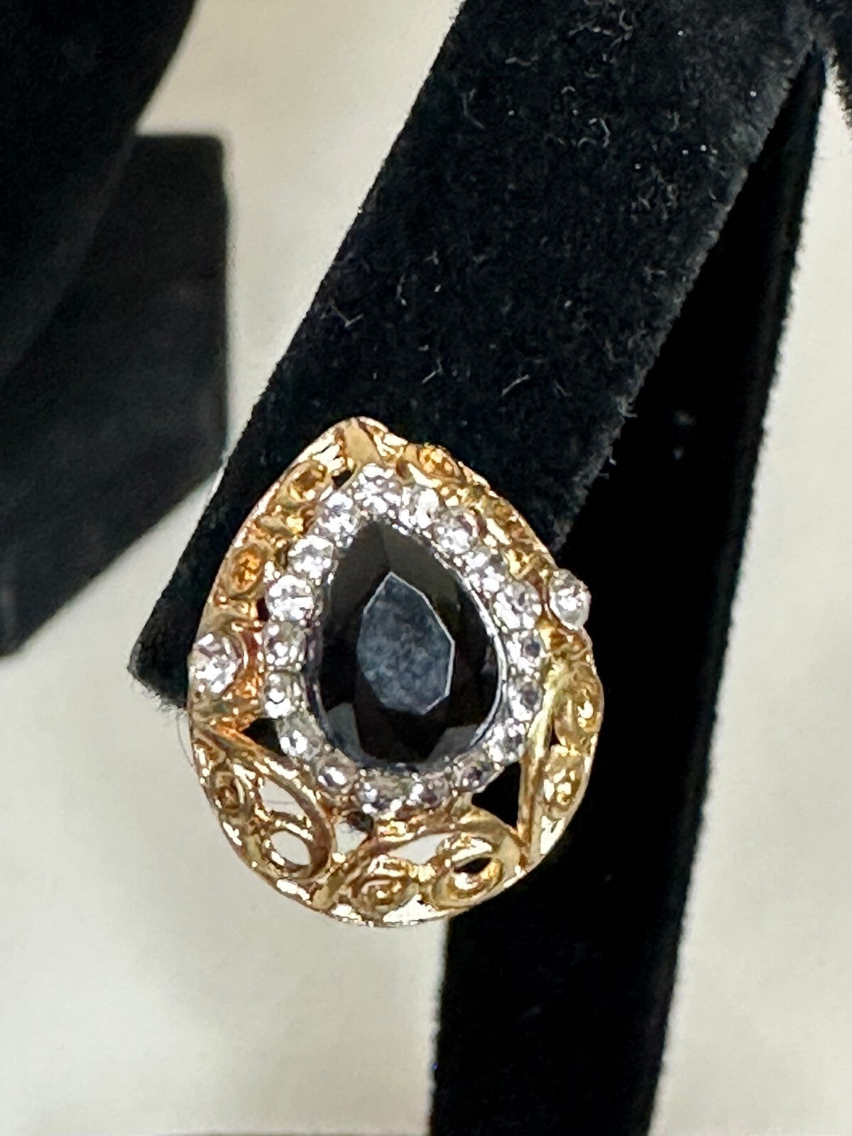 Matching gold-tone black and crystal teardrop earrings and pendant set