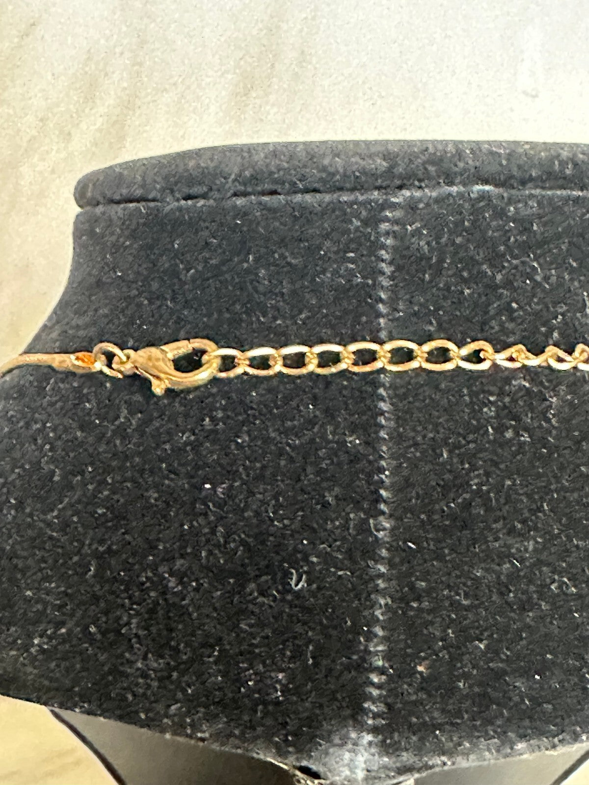 Matching gold-tone black and crystal teardrop earrings and pendant set