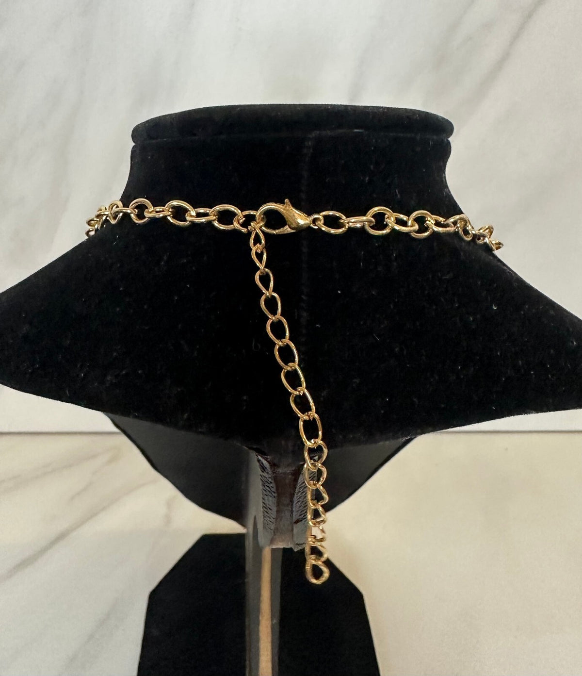 Purple faceted stone geometric gold tone statement bib necklace