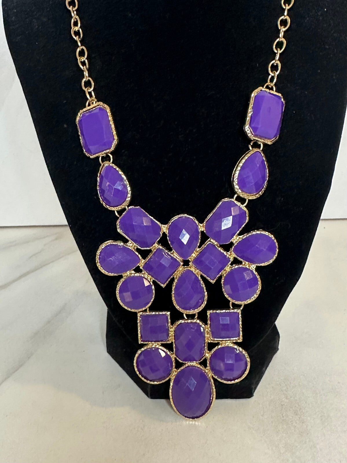 Purple faceted stone geometric gold tone statement bib necklace