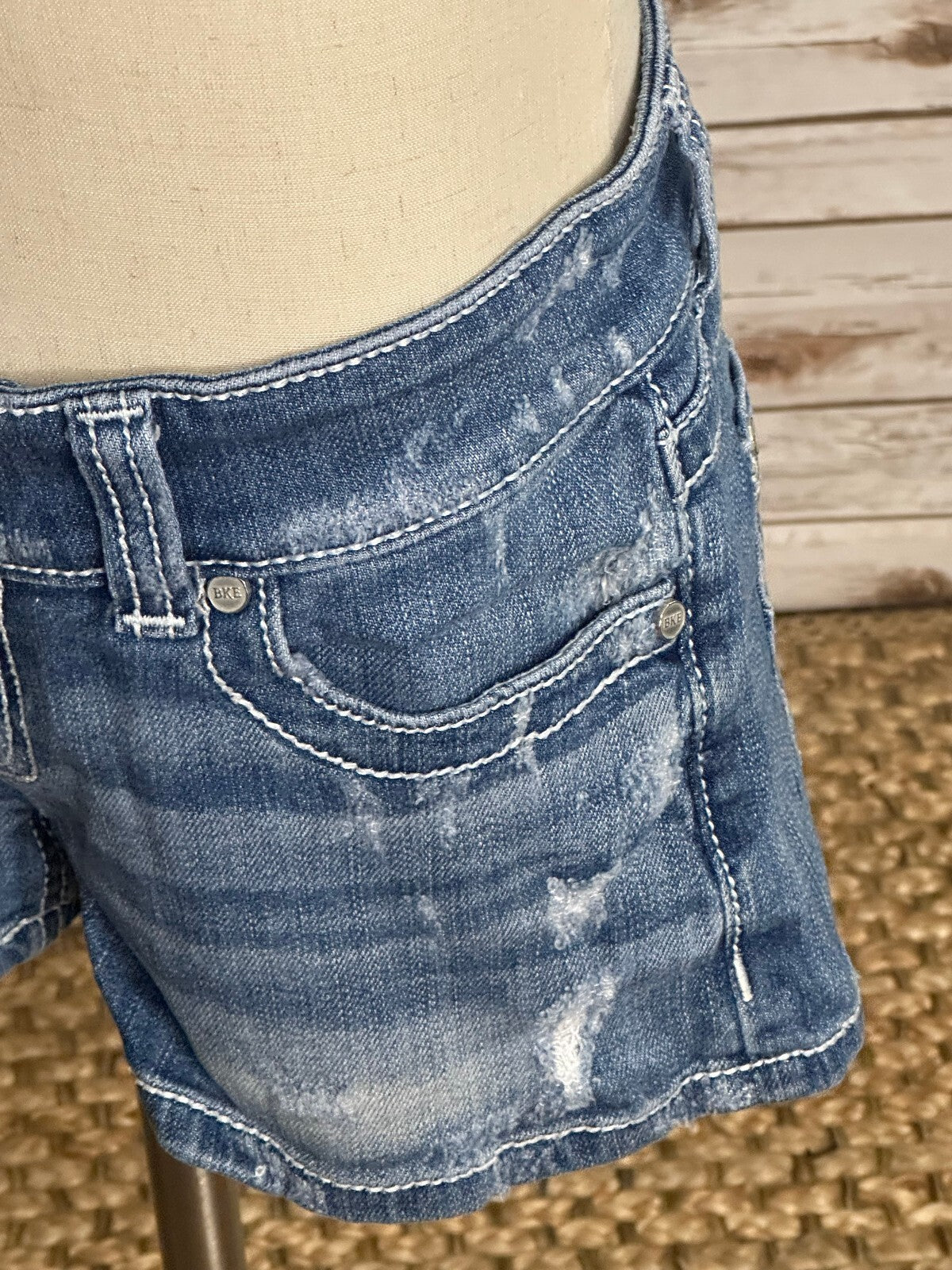 BKE Sabrina medium wash low-rise distressed stretch denim shorts Size 26 Y2K