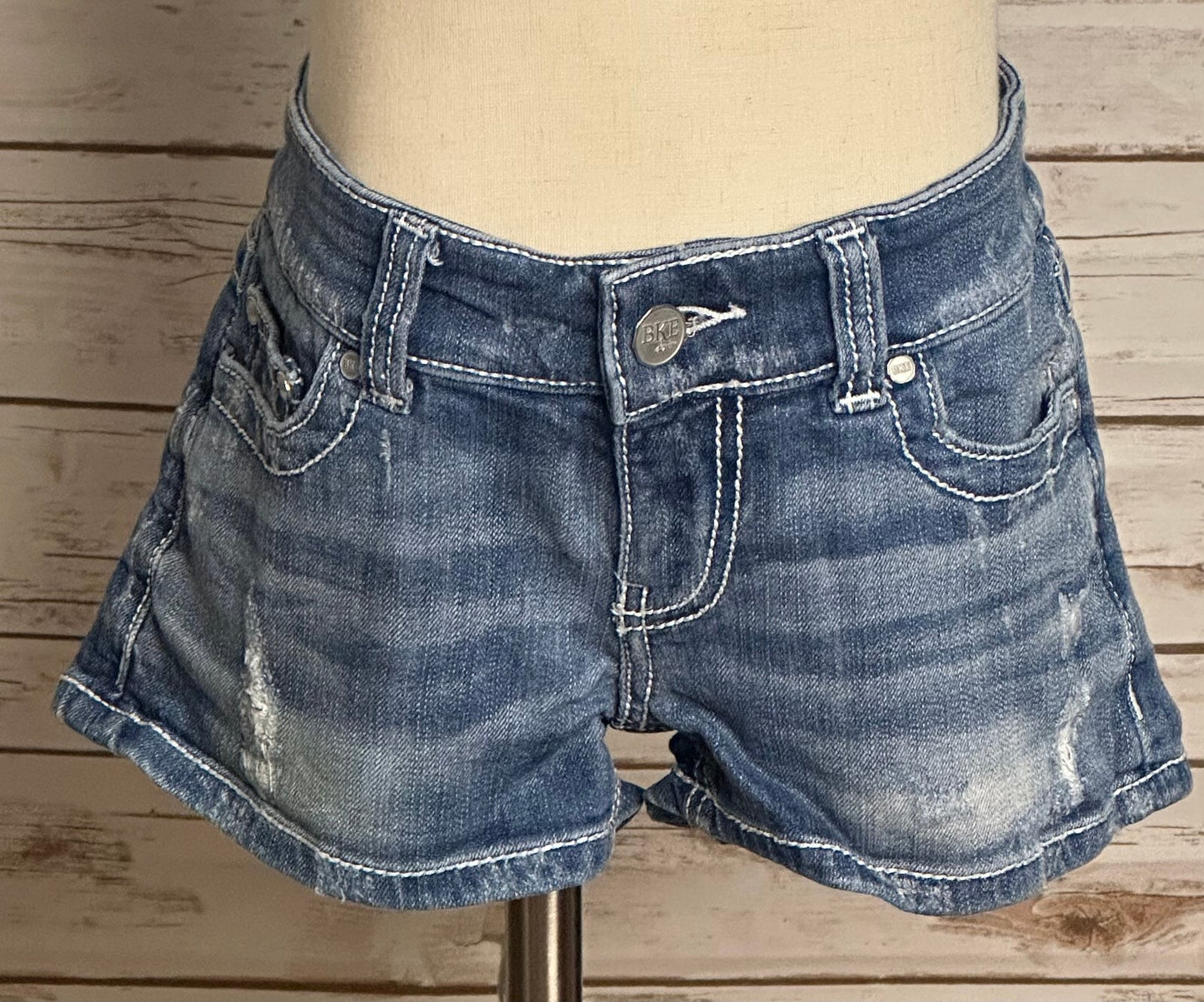 BKE Sabrina medium wash low-rise distressed stretch denim shorts Size 26 Y2K