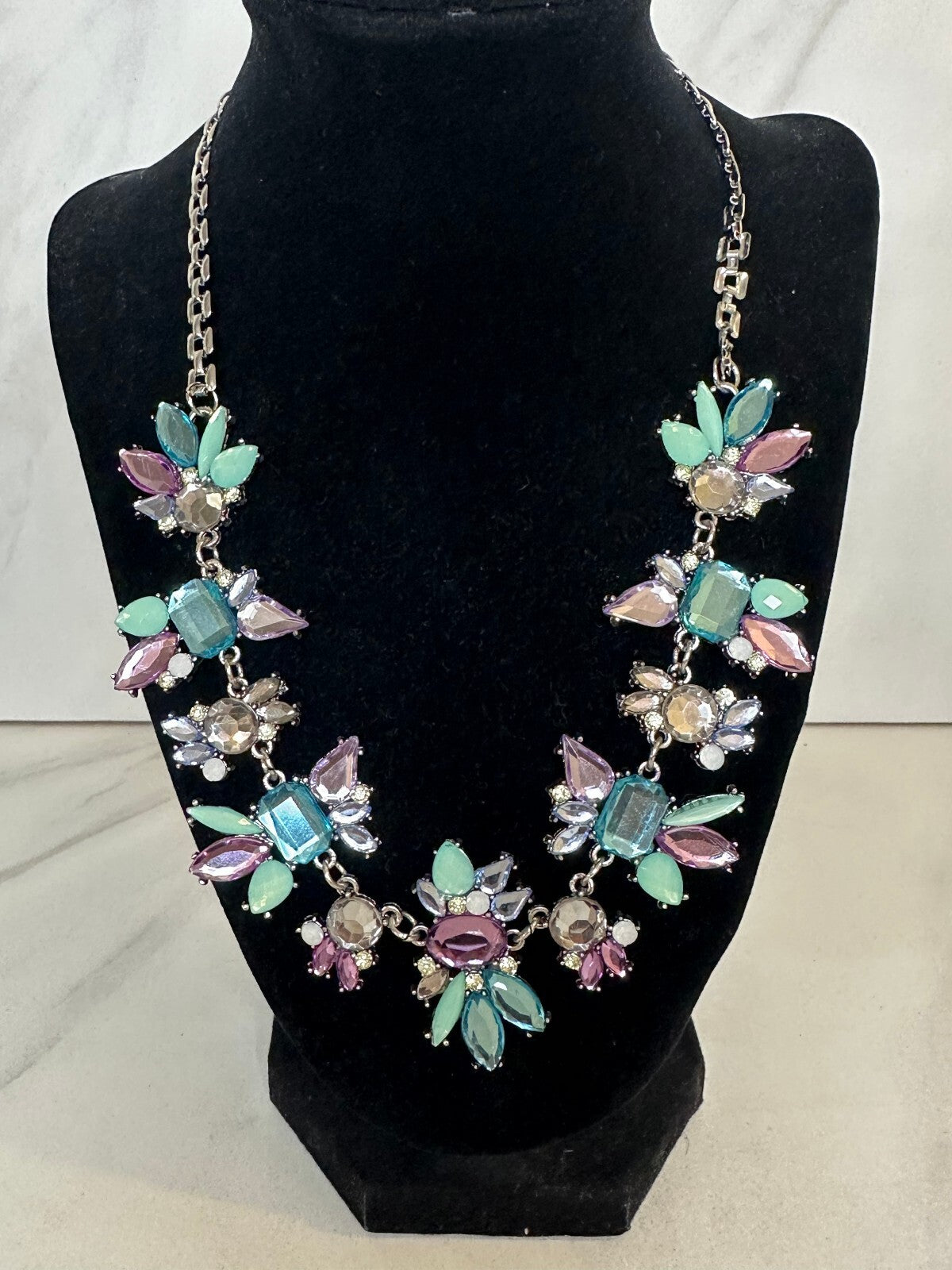 Pastel multicolored floral cluster silver tone adjustable statement bib necklace